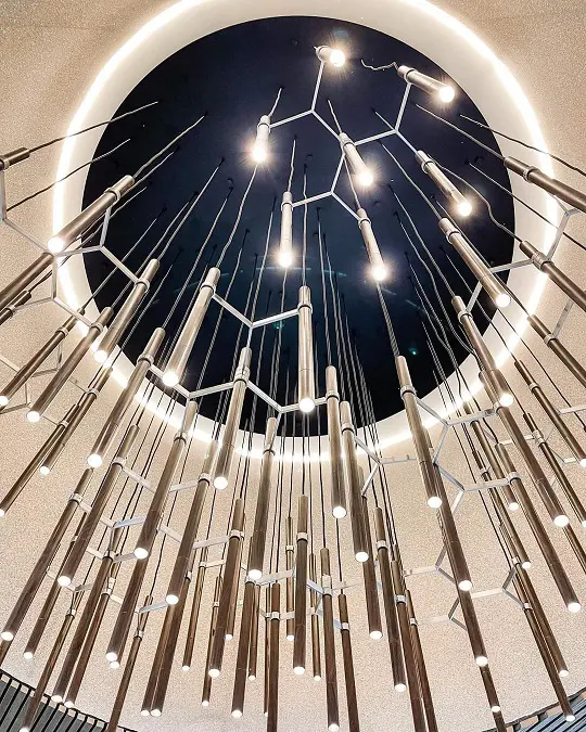 Designer lighting arrangements inside a hotel lobby